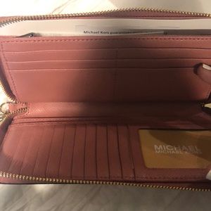 Michael Kors Bags - Michael KORS pink Wallet (NEVER USED) Michael Kors Bags - Michael KORS pink Wallet (NEVER USED)